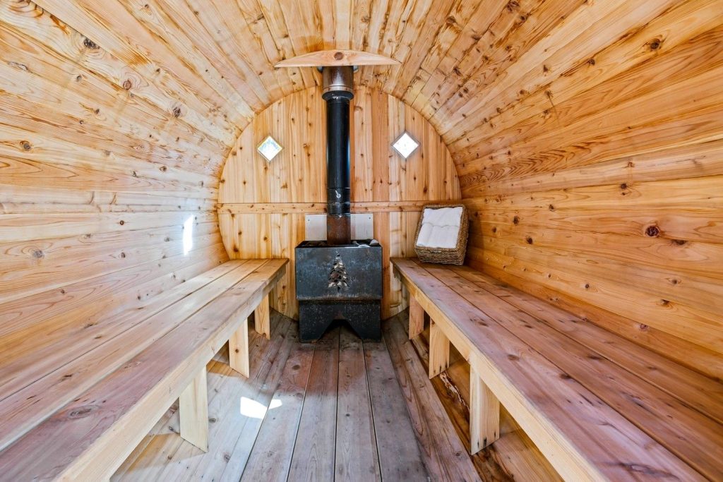 Wood-burning stove inside a barrel sauna